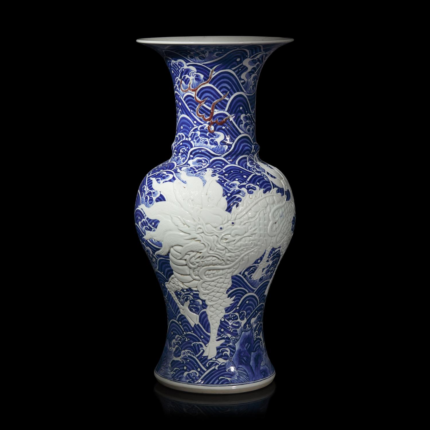 A Large Japanese Carved Blue and White and Red Porcelain 'Kylin on Waves' Vase, Meiji Period 日本明治時期 青花麒麟紋大瓶
