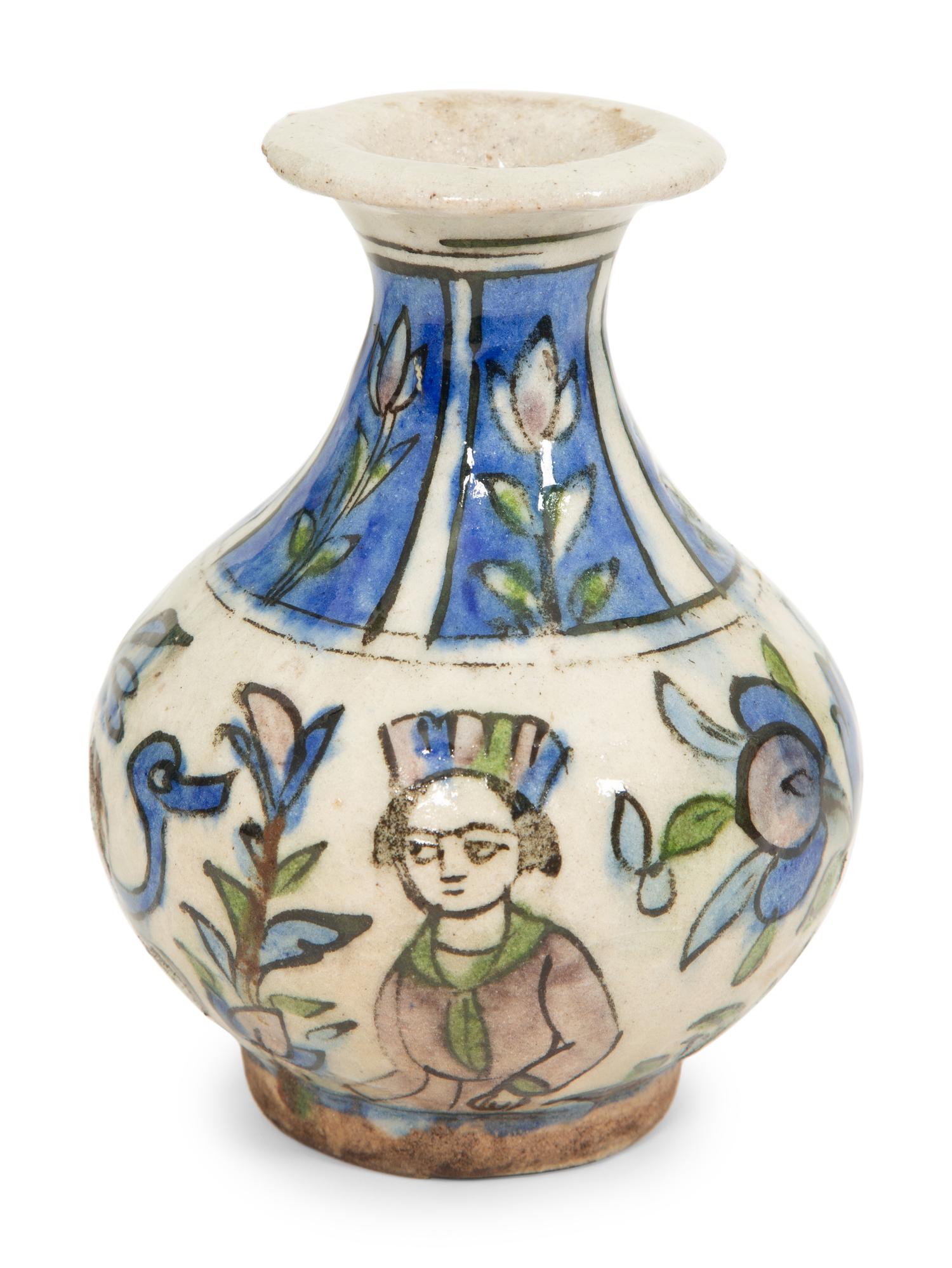 An Islamic Iznik Glazed Pottery Plate and a Small Vase
