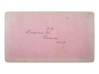 [WESTERN AMERICANA - ARIZONA]. BUEHMAN, Henry (1851-1912), photographer. A group of 2 stereoviews of Tucson, incl. view of Congress Street and horse-drawn ore cart passing through town. Tucson, Arizona Territory, ca 1870s.