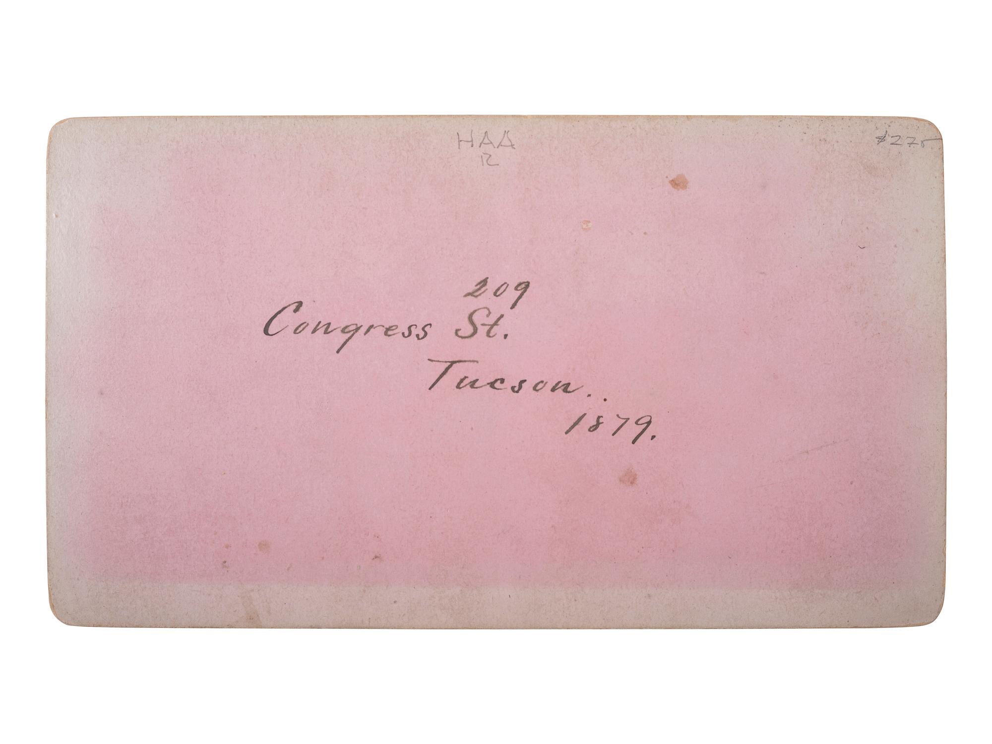 [WESTERN AMERICANA - ARIZONA]. BUEHMAN, Henry (1851-1912), photographer. A group of 2 stereoviews of Tucson, incl. view of Congress Street and horse-drawn ore cart passing through town. Tucson, Arizona Territory, ca 1870s.