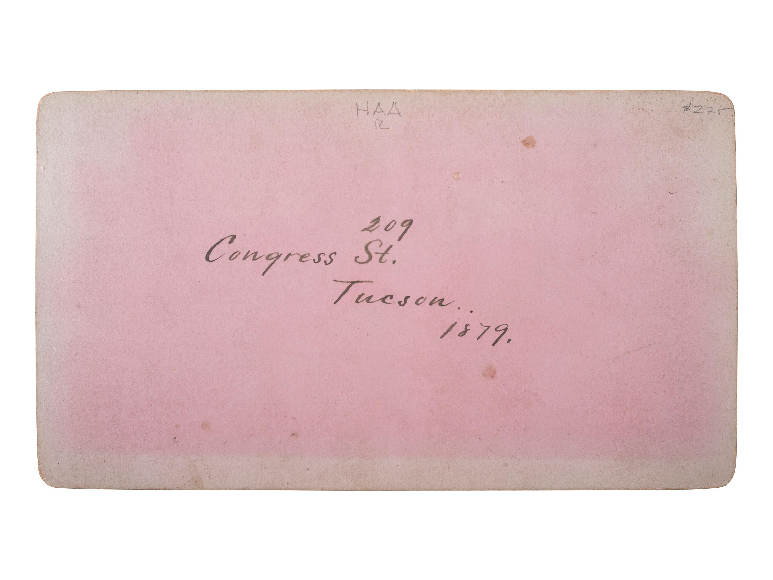 [WESTERN AMERICANA - ARIZONA]. BUEHMAN, Henry (1851-1912), photographer. A group of 2 stereoviews of Tucson, incl. view of Congress Street and horse-drawn ore cart passing through town. Tucson, Arizona Territory, ca 1870s.