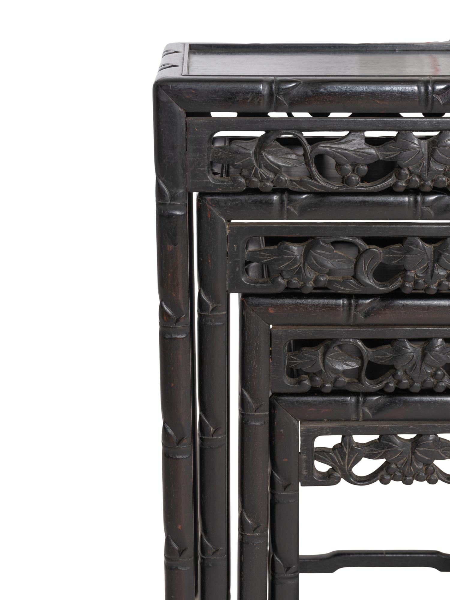 A Set of Four Chinese Ebonized Carved Teak Nesting Tables
