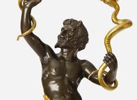 A large pair of Louis XVI style gilt and patinated bronze wall sconces depicting mermen, late 19th century