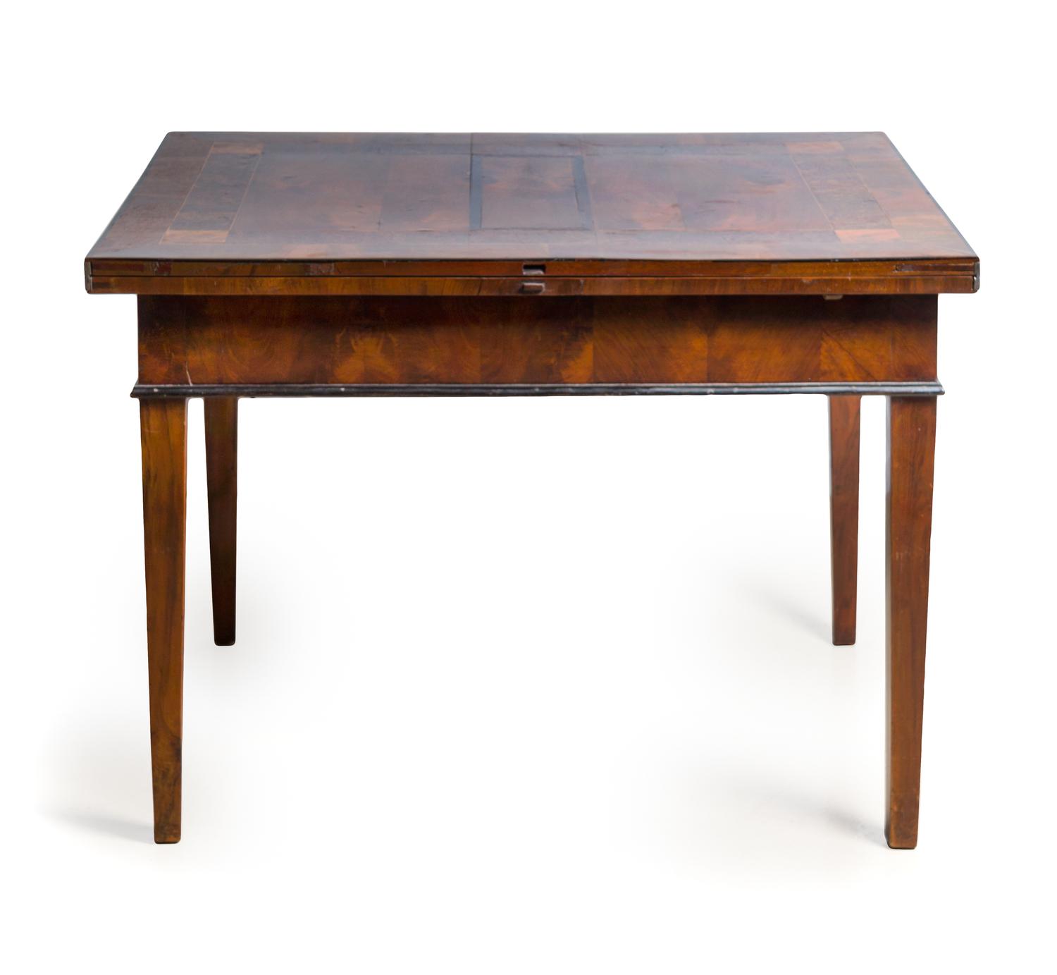 An English Parcel Ebonized Mahogany Folding Dining Table Height 29 x width 78 1/2 x depth 42 inches.