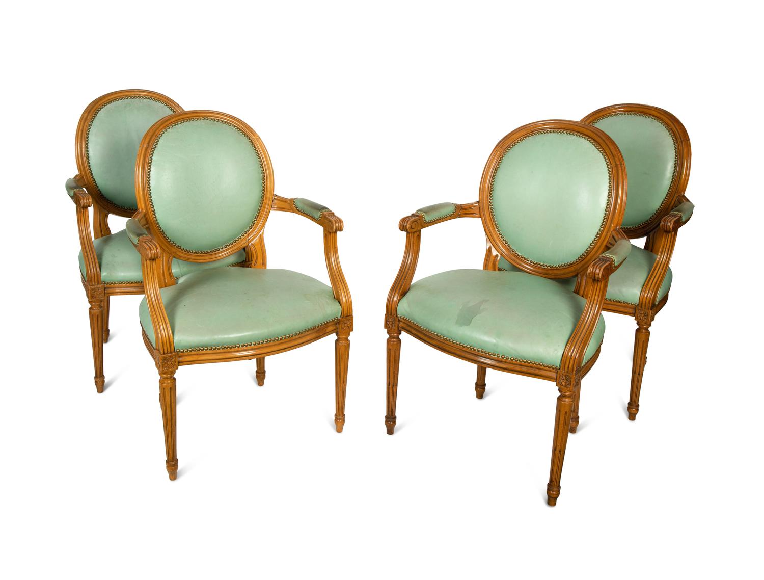 A Set of Four Louis XVI Style Leather-Upholstered Fauteuils