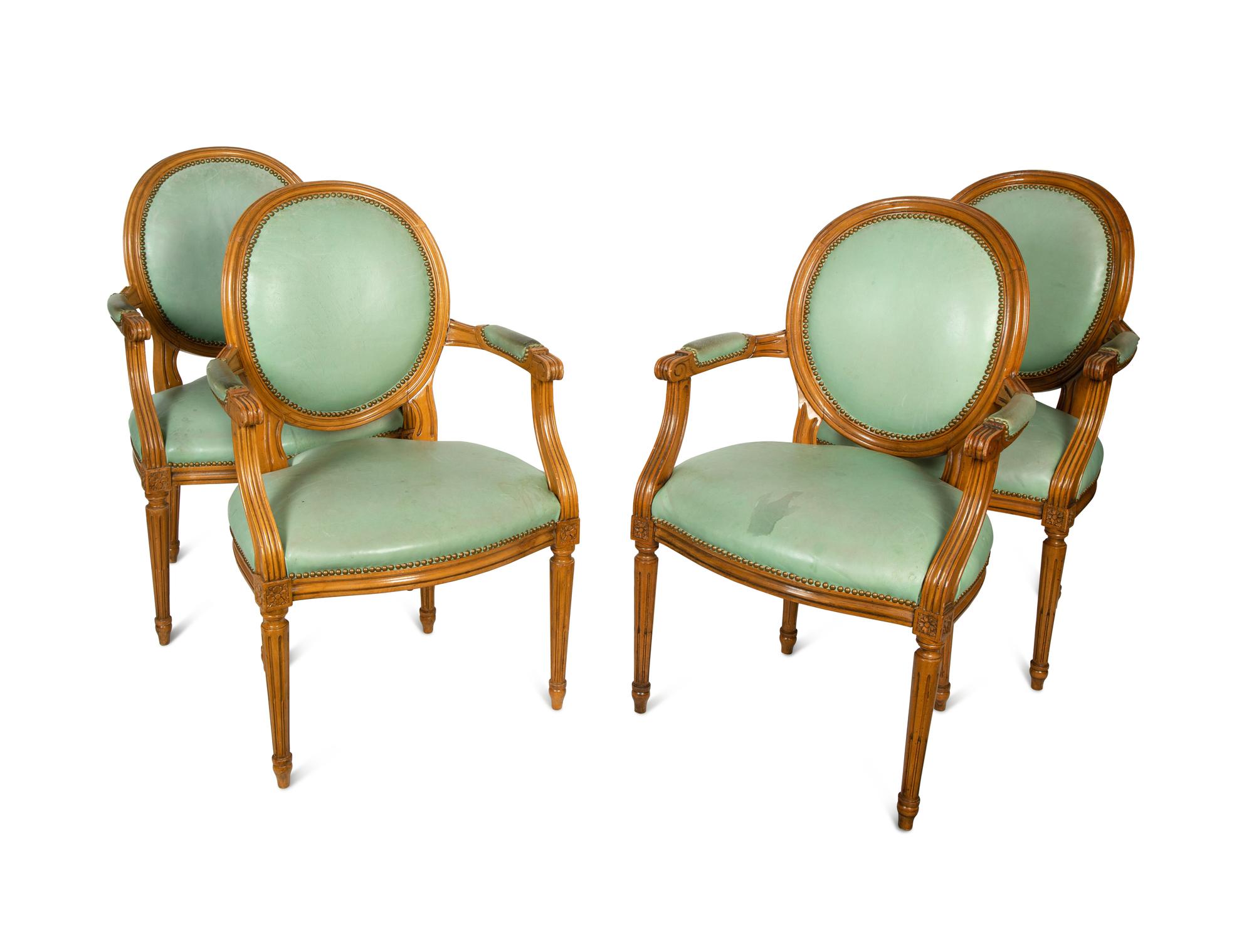 A Set of Four Louis XVI Style Leather-Upholstered Fauteuils