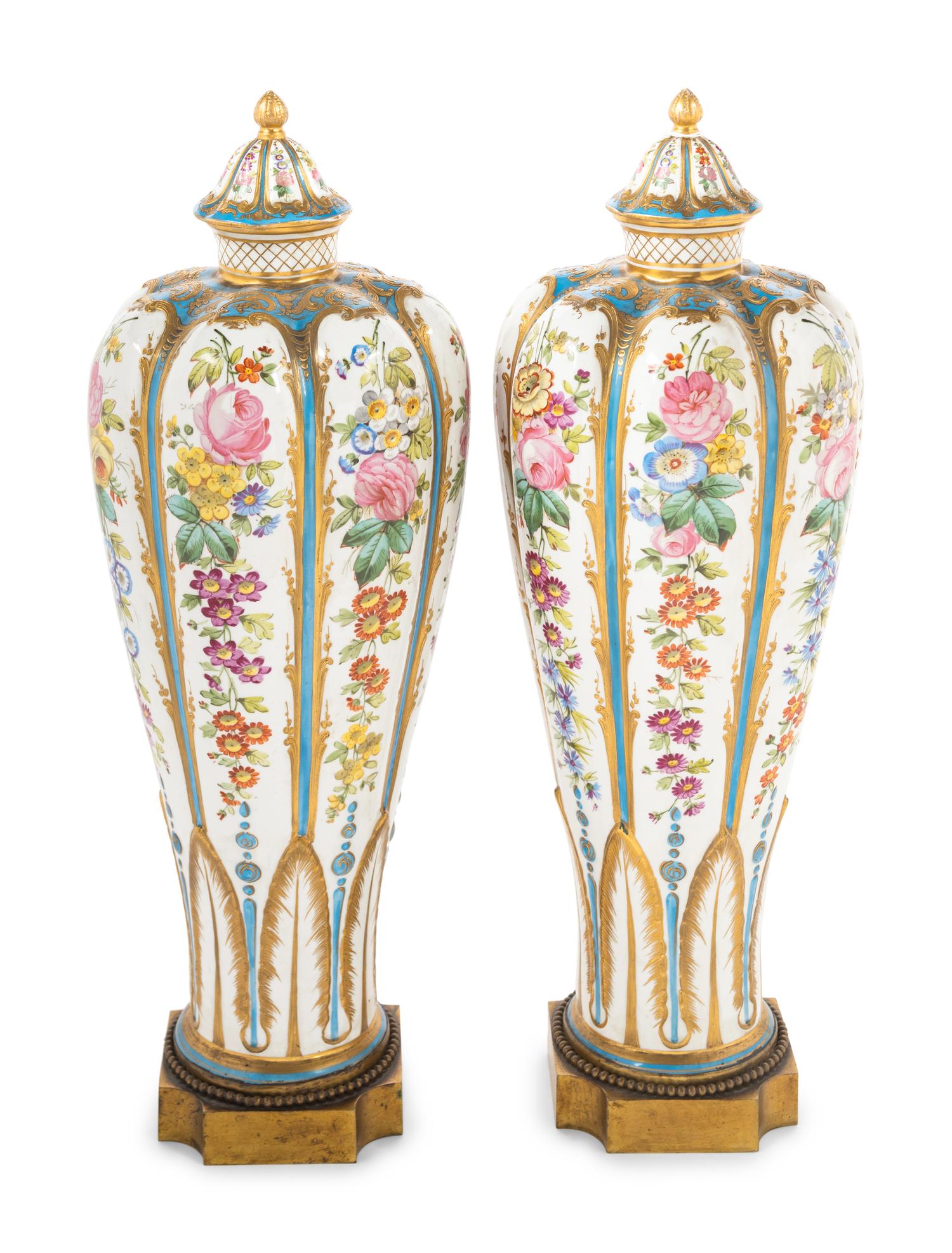 A Pair of Sèvres Style Porcelain Covered Vases