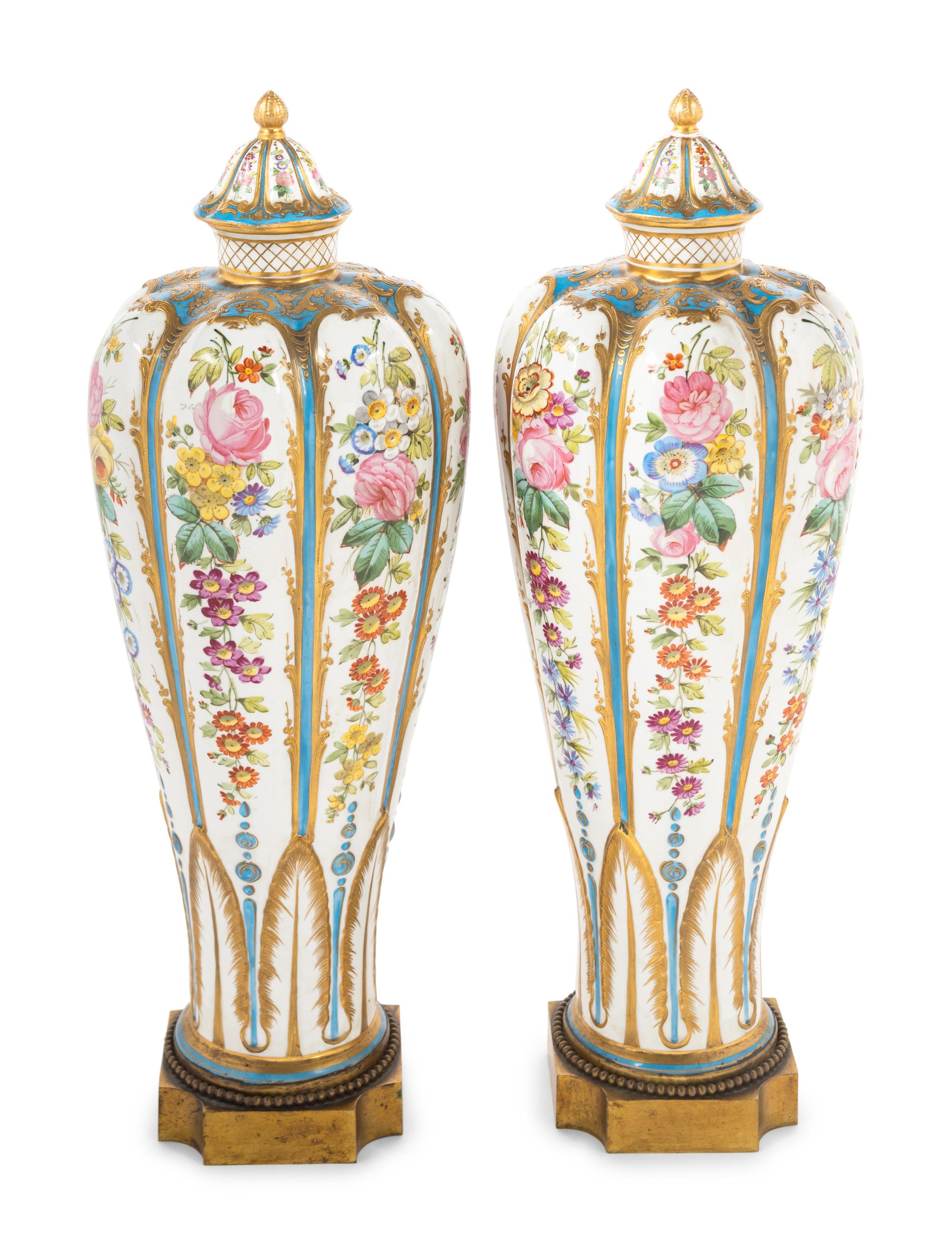 A Pair of Sèvres Style Porcelain Covered Vases