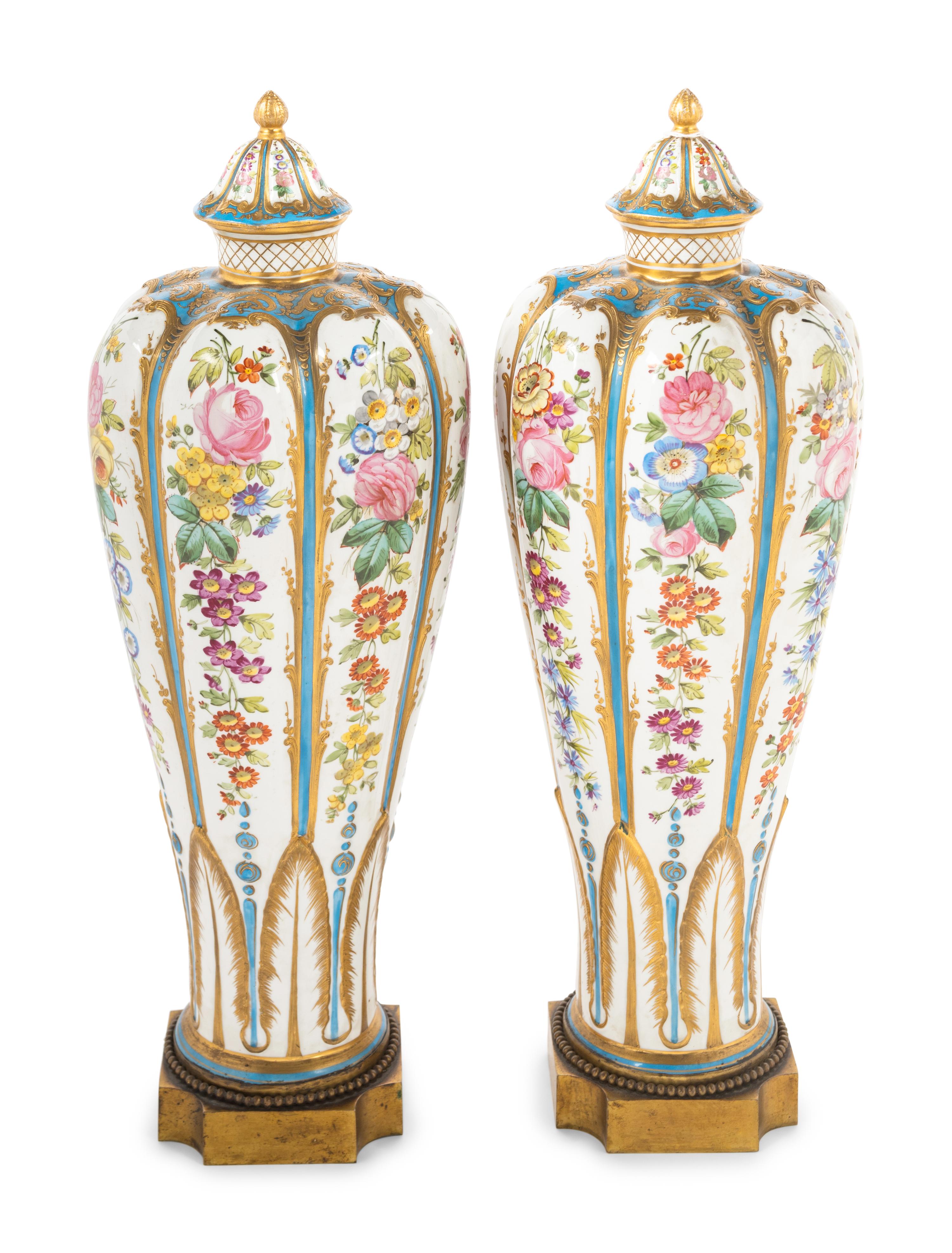 A Pair of Sèvres Style Porcelain Covered Vases