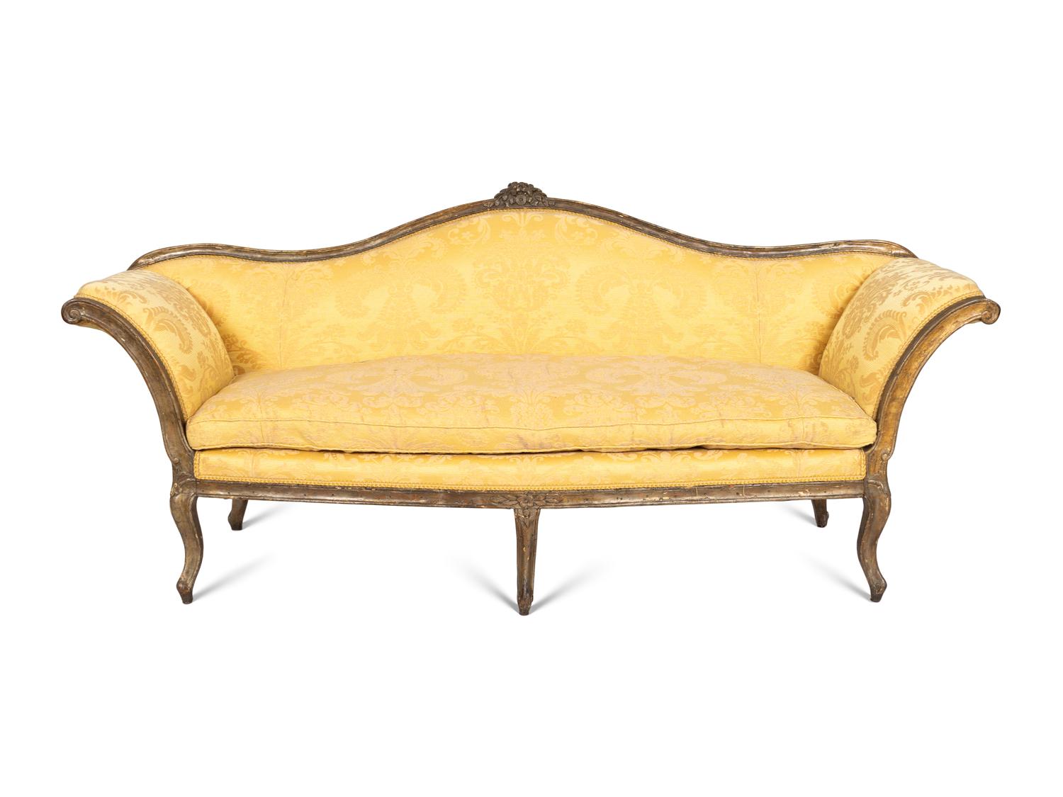 An Italian Rococo Silvered and Gilt Walnut Sofa