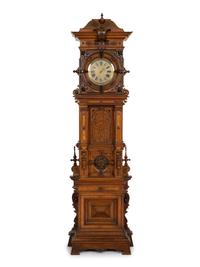 A German Carved Walnut and Marquetry Tall Case Clock