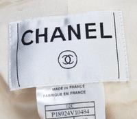 A Chanel Ivory Boucle Jacket, Size 40.