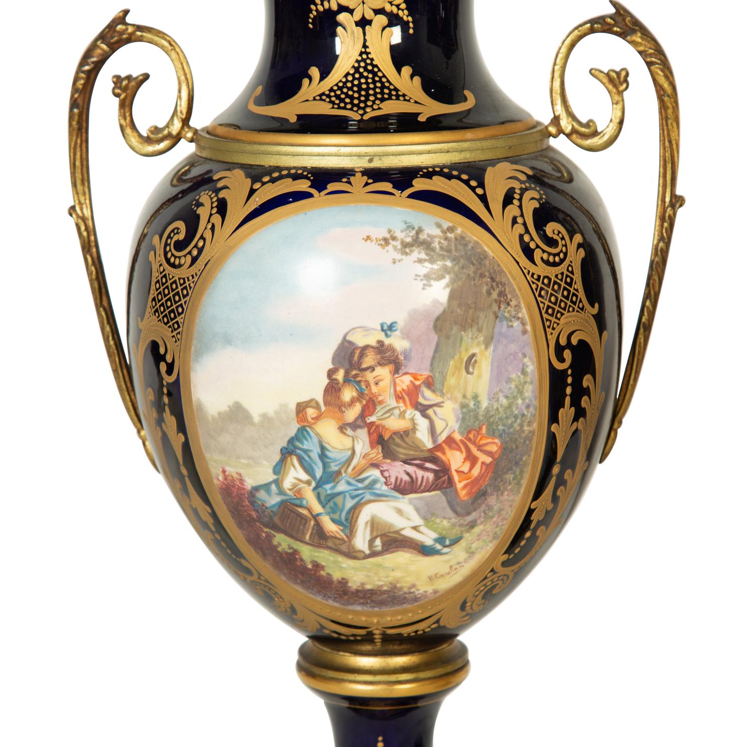 A Pair of Sèvres Style Porcelain Urns