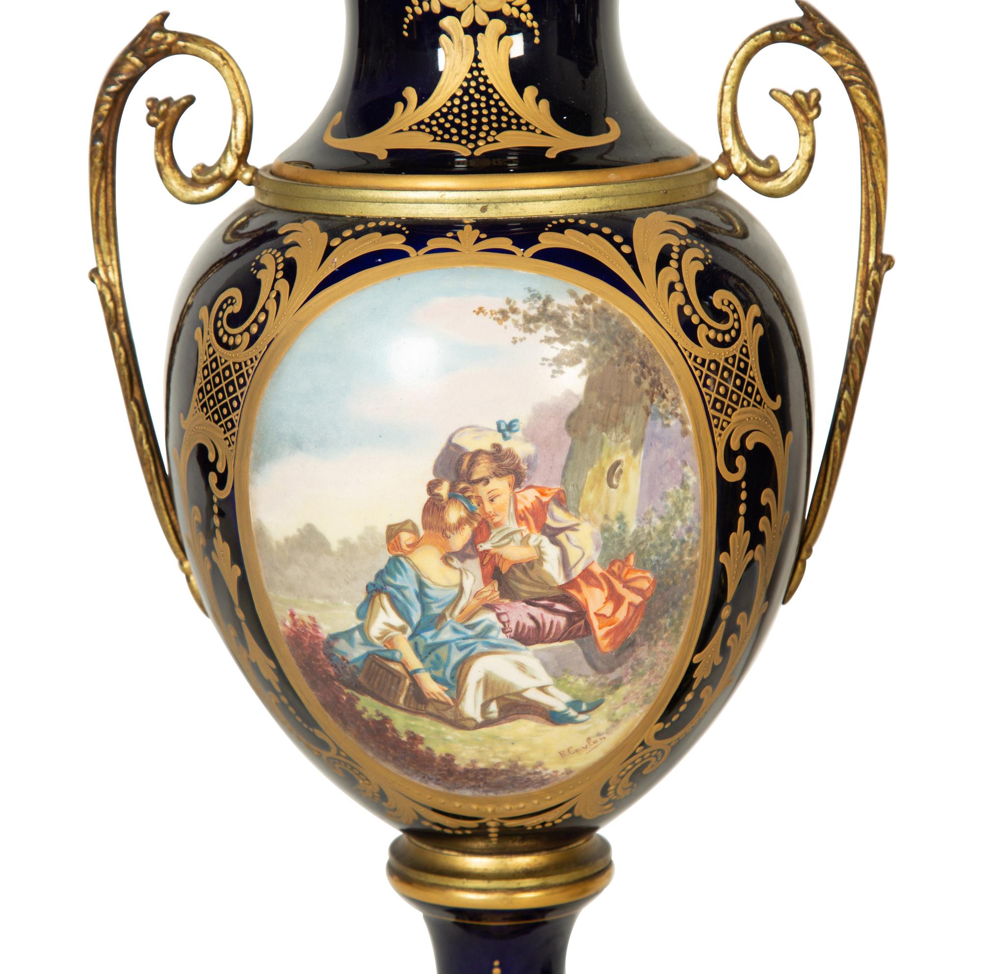 A Pair of Sèvres Style Porcelain Urns