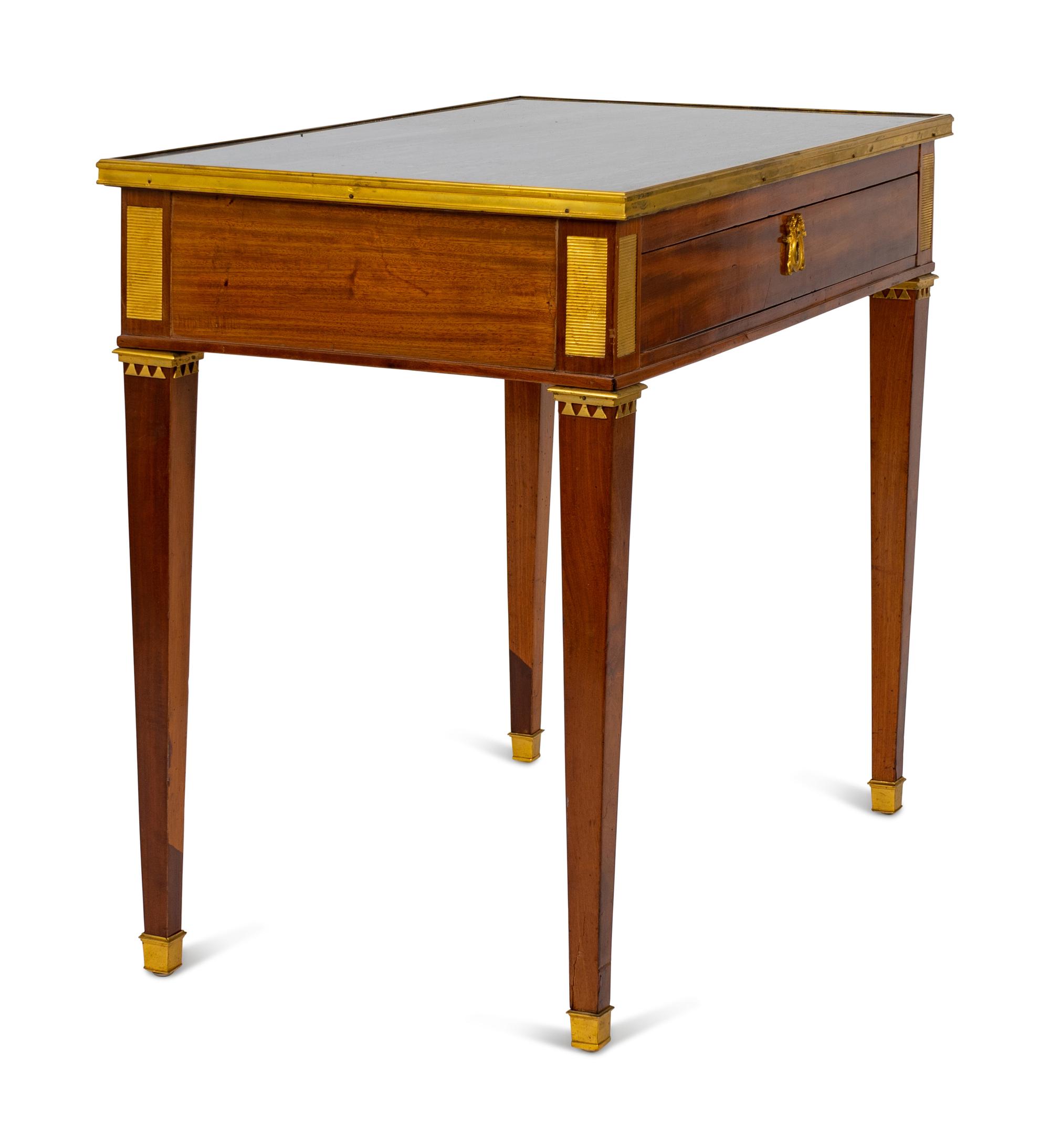 A Louis XVI Style Bronze Mounted Marble Top Writing Table — LATE 19TH CENTURY