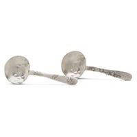 Pair of 'Lap-Over-Edge' Japanesque sterling silver serving spoons Tiffany & Co., New York, NY, circa 1880