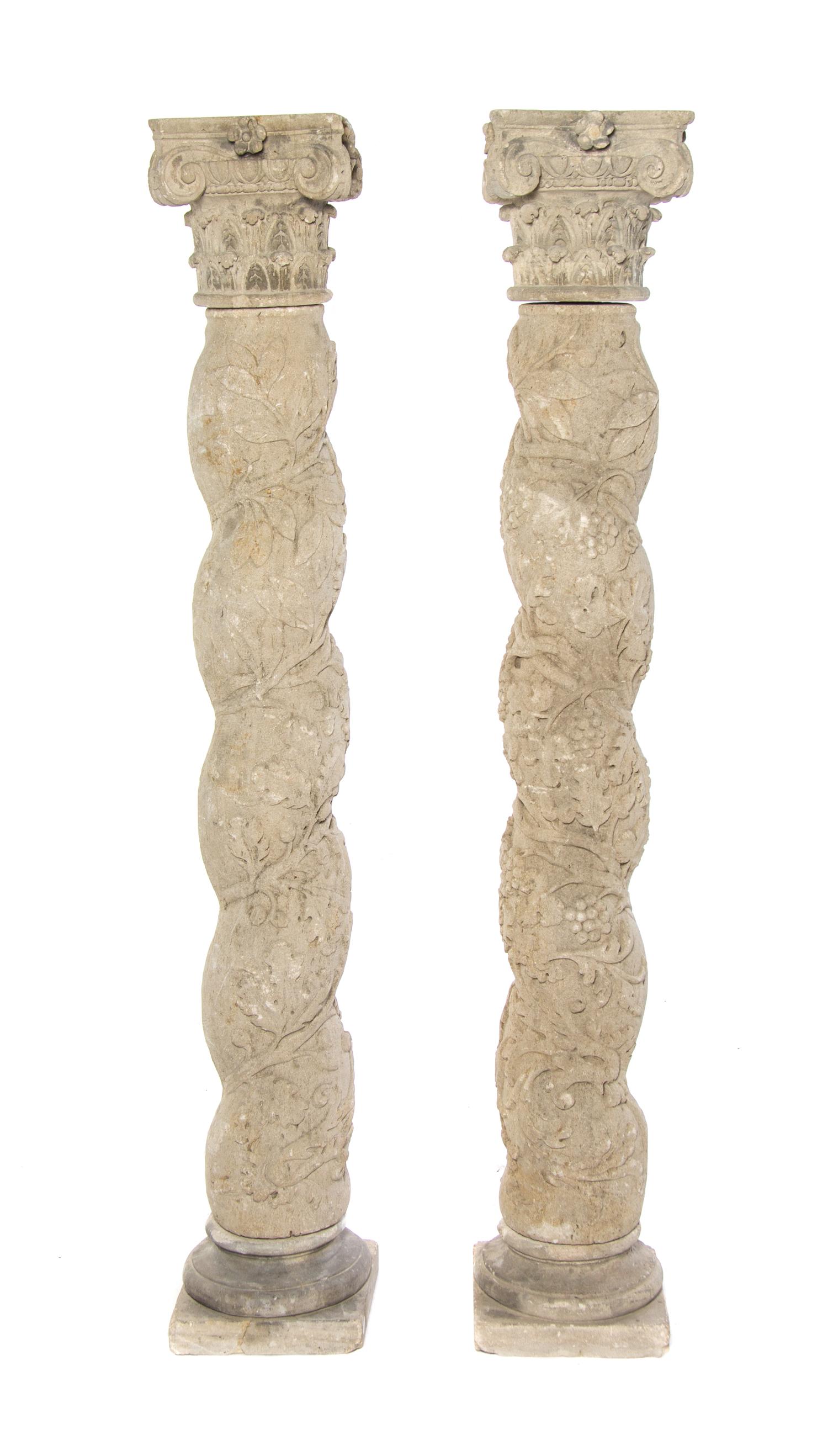 A Pair of Solomonic Cast Stone Columns, Height 69 inches.