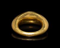 A Roman Gold and Garnet Finger Ring with the God Eros
