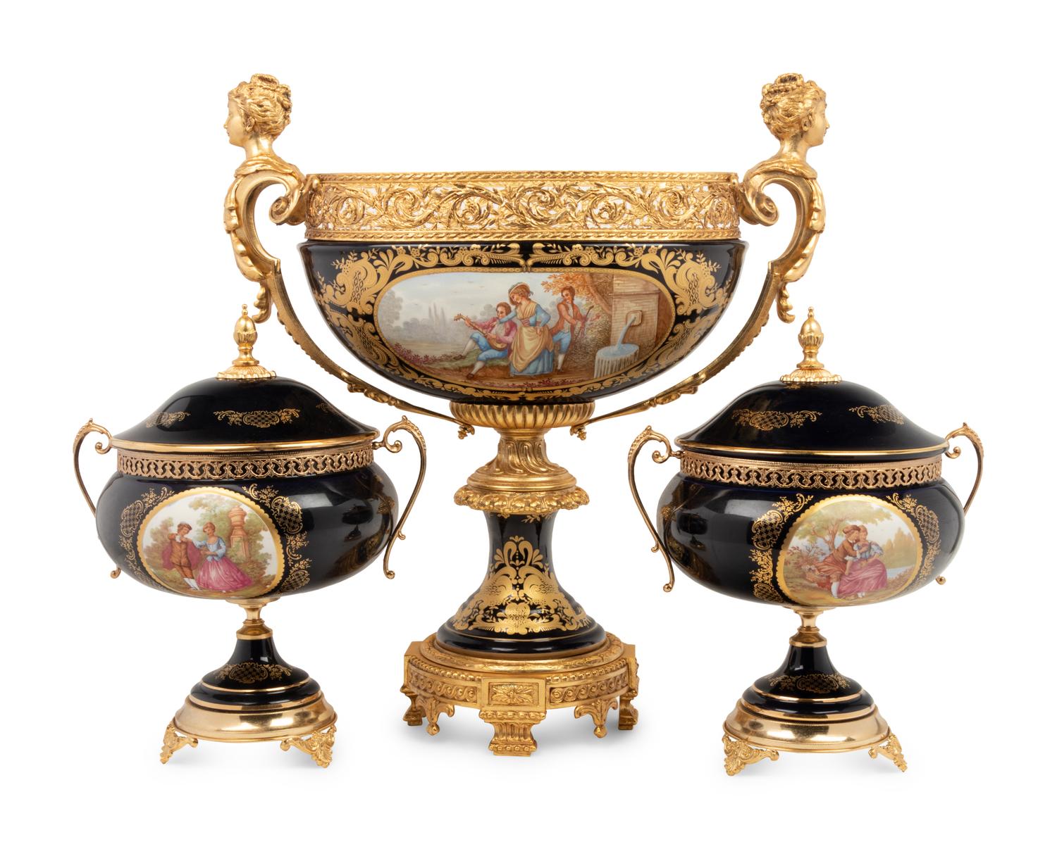 A Louis XV Limoges Style Gilt Bronze Mounted Porcelain Table Garniture