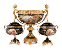 A Louis XV Limoges Style Gilt Bronze Mounted Porcelain Table Garniture