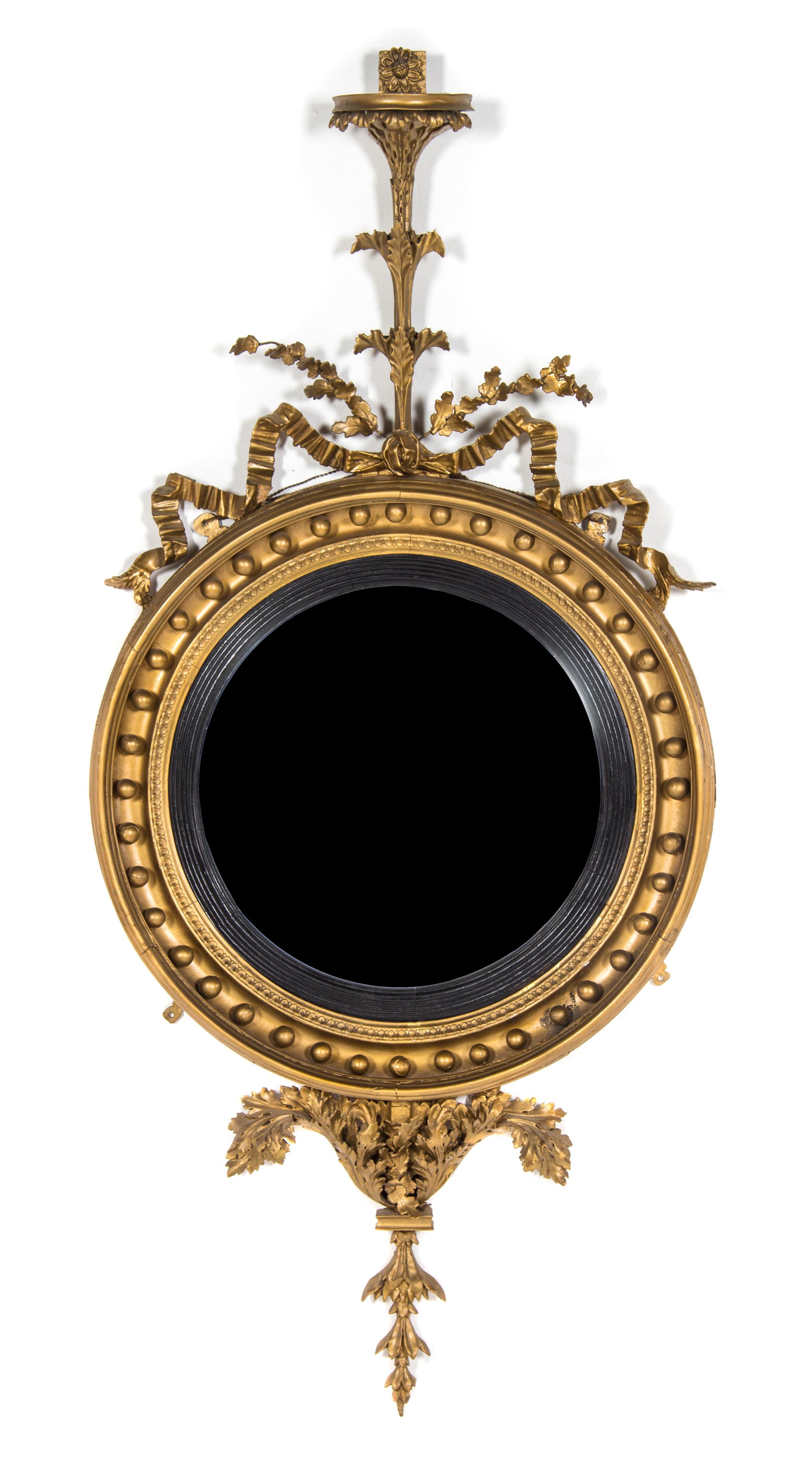 An American Federal Parcel Ebonized Giltwood Bull's Eye Mirror, 18TH/19TH CENTURY WITH LATER GILT, Height 55 x width 27 inches. — 18TH/19TH CENTURY WITH LATER GILT,