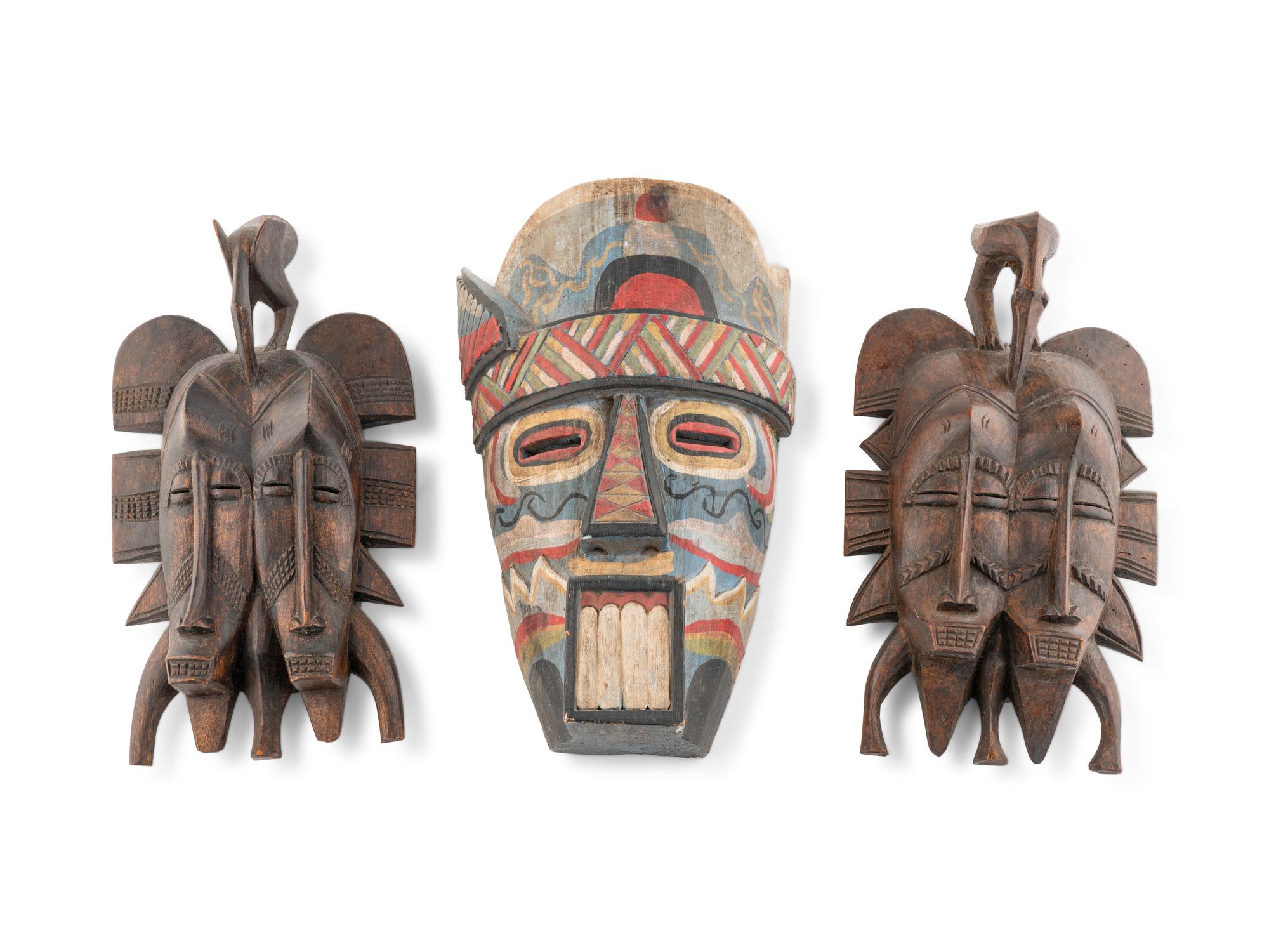 A Group of Three West African Carved Masks
