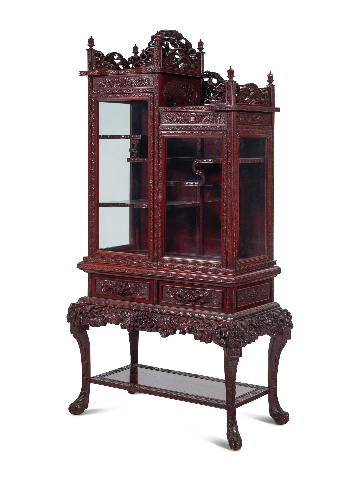 A Japanese Export Carved Hardwood Displaying Cabinet