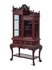 A Japanese Export Carved Hardwood Displaying Cabinet