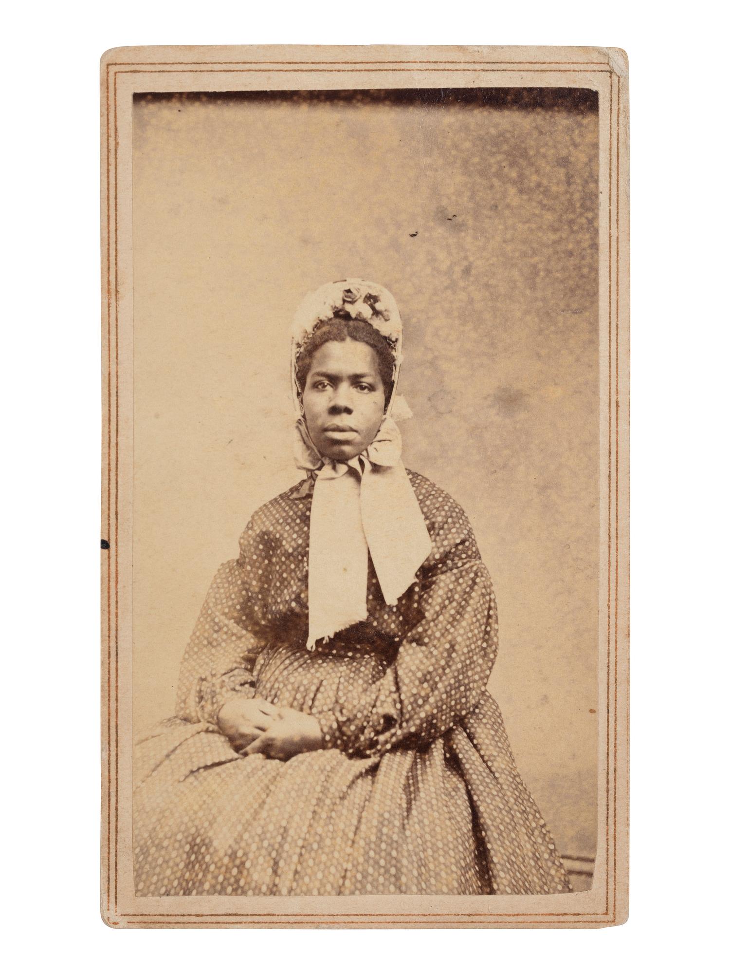 [EARLY PHOTOGRAPHY]. CDV of a young African American woman identified as a servant aboard the USS Neptune . New York: J.B. Gardner, ca 1865-1866.