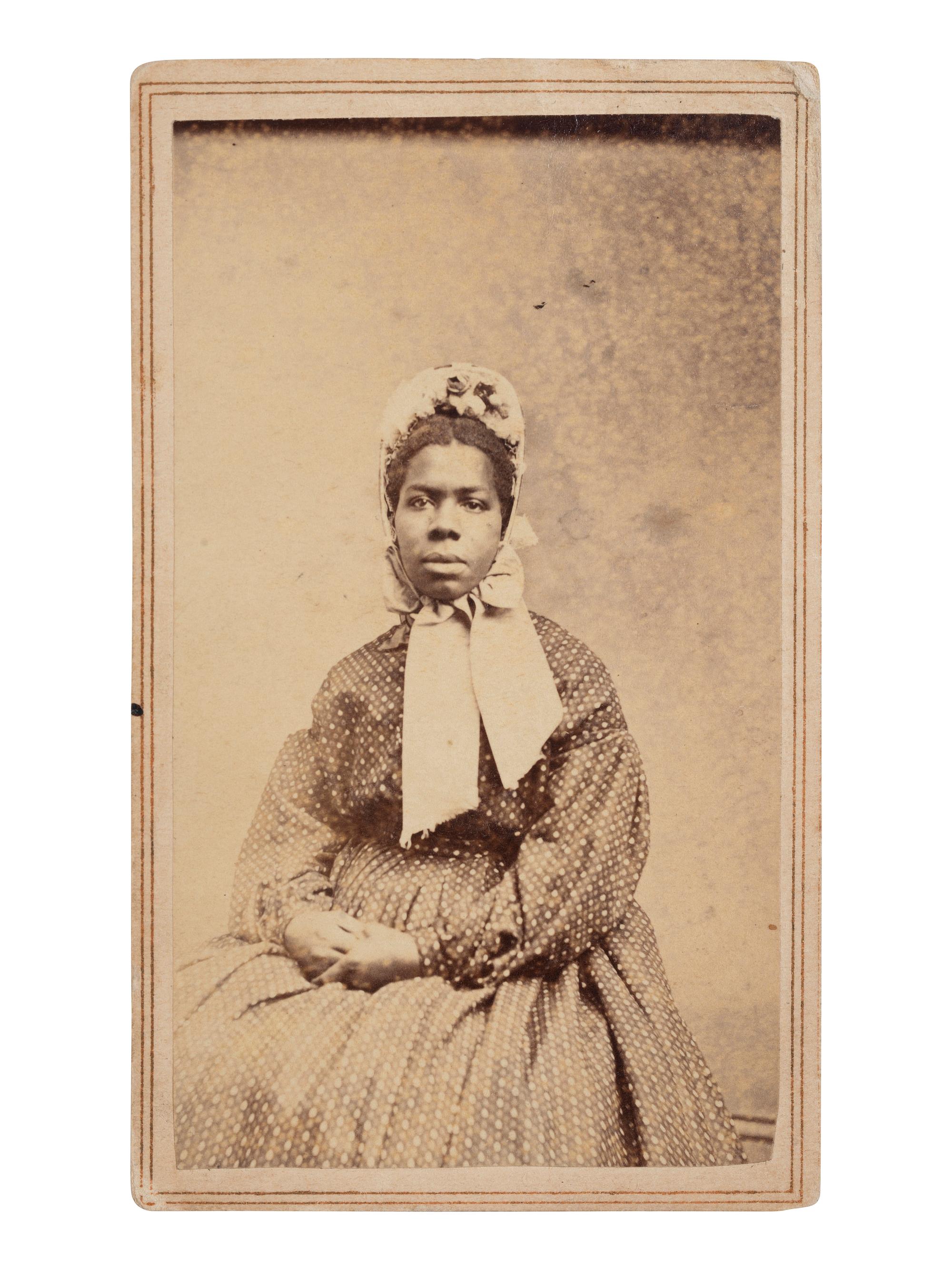 [EARLY PHOTOGRAPHY]. CDV of a young African American woman identified as a servant aboard the USS Neptune . New York: J.B. Gardner, ca 1865-1866.