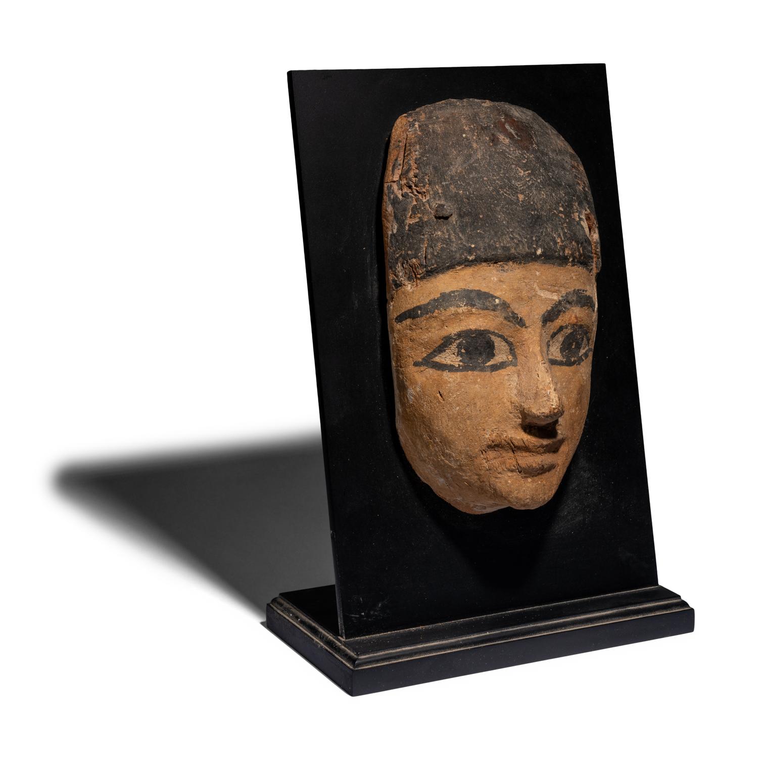 An Egyptian Painted Wood Mummy Mask