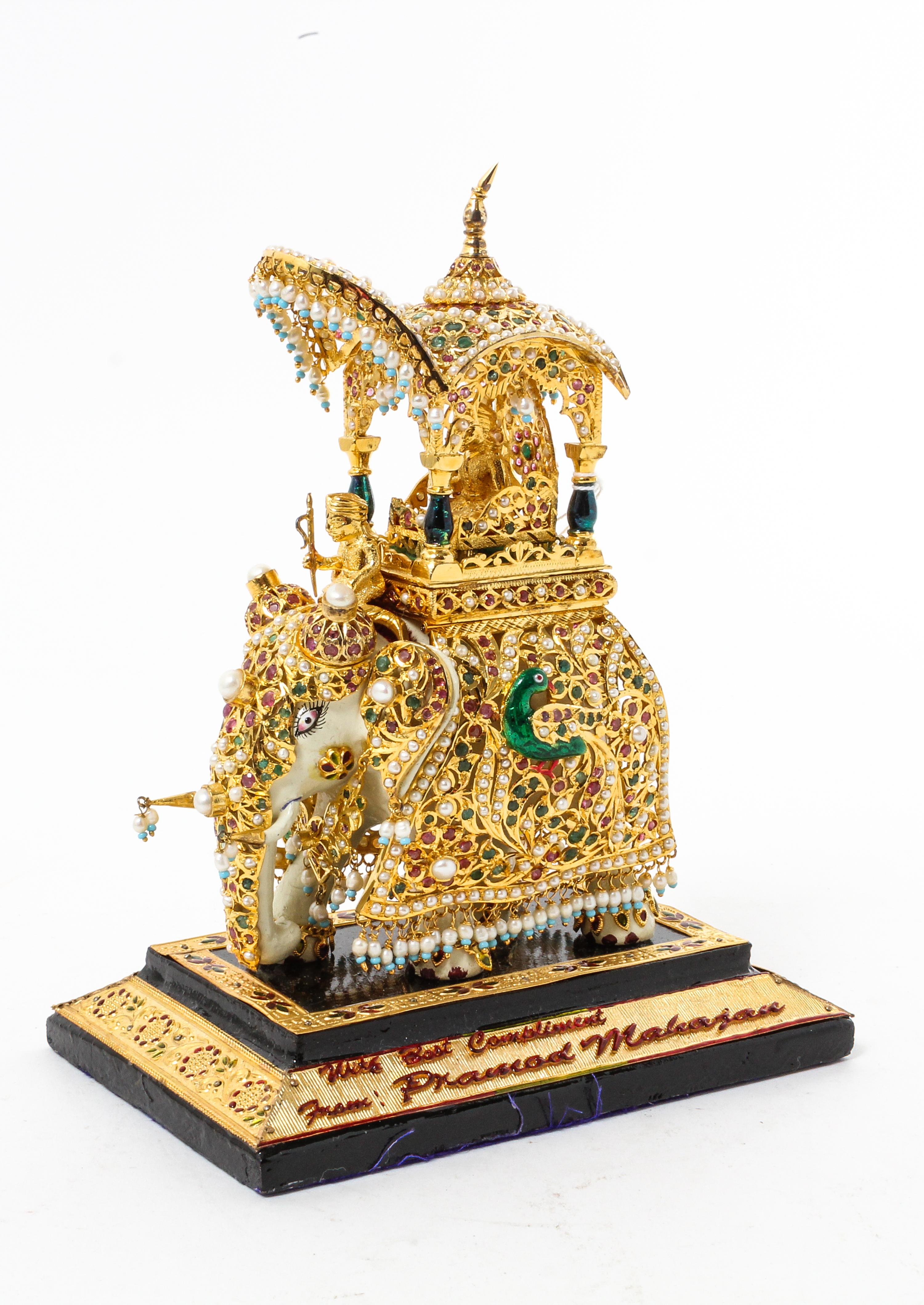 An Indian Gilt Decorated Composite Model of an Elephant Height overall 8 inches.