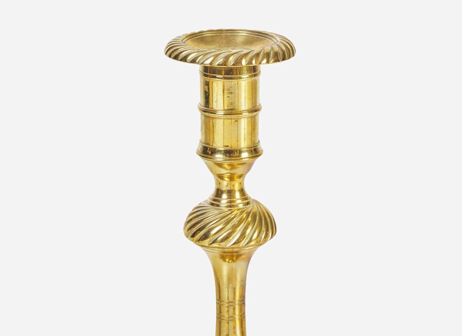 A group of six English brass candlesticks, 18th century