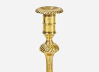 A group of six English brass candlesticks, 18th century