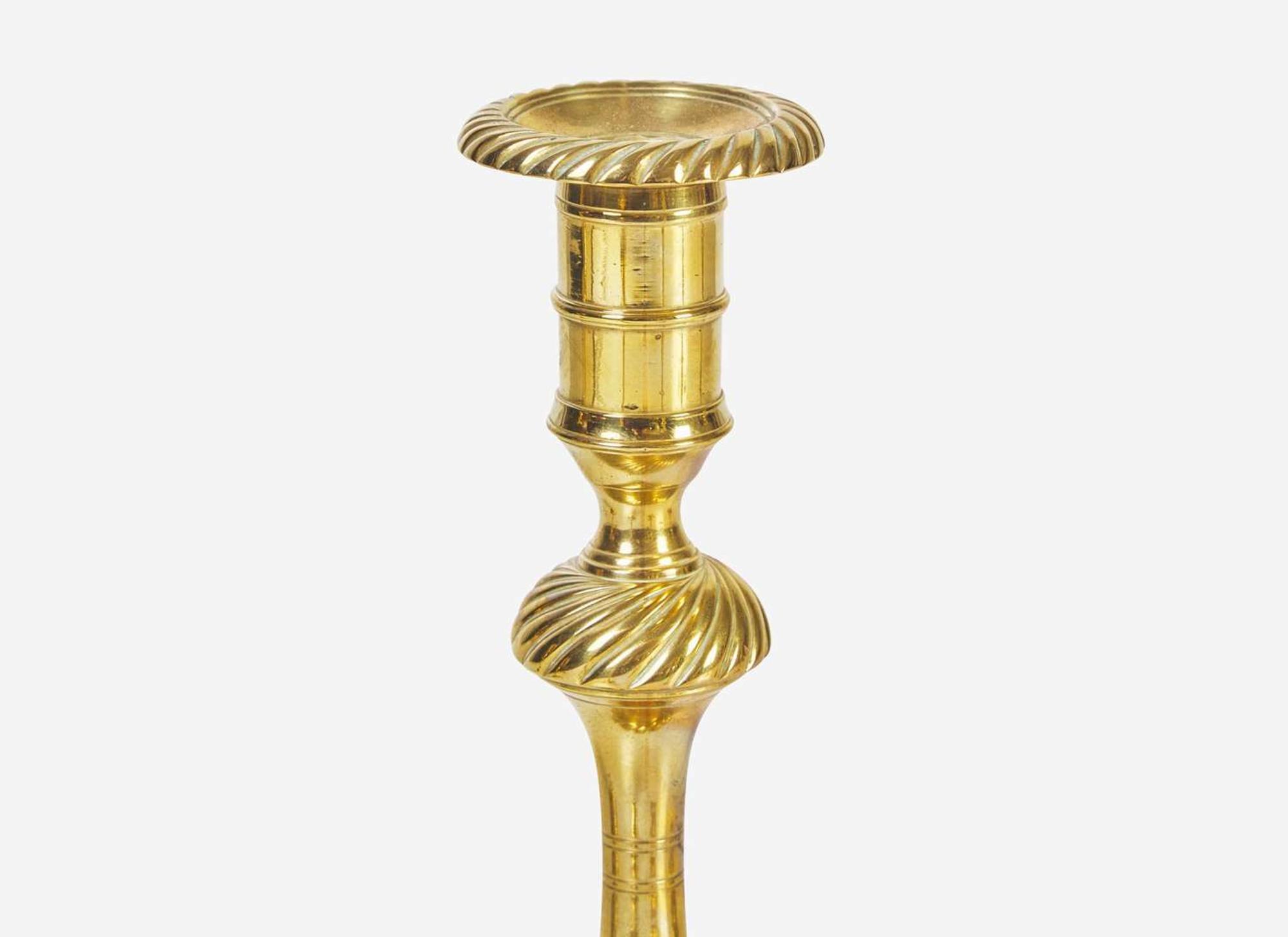 A group of six English brass candlesticks, 18th century