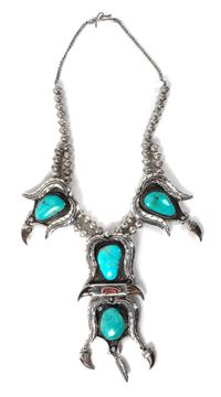 A Large Silver, Turquoise and Coral Pendant Necklace Length 20 inches; height of pendant 6 x width 2 3/4 inches.