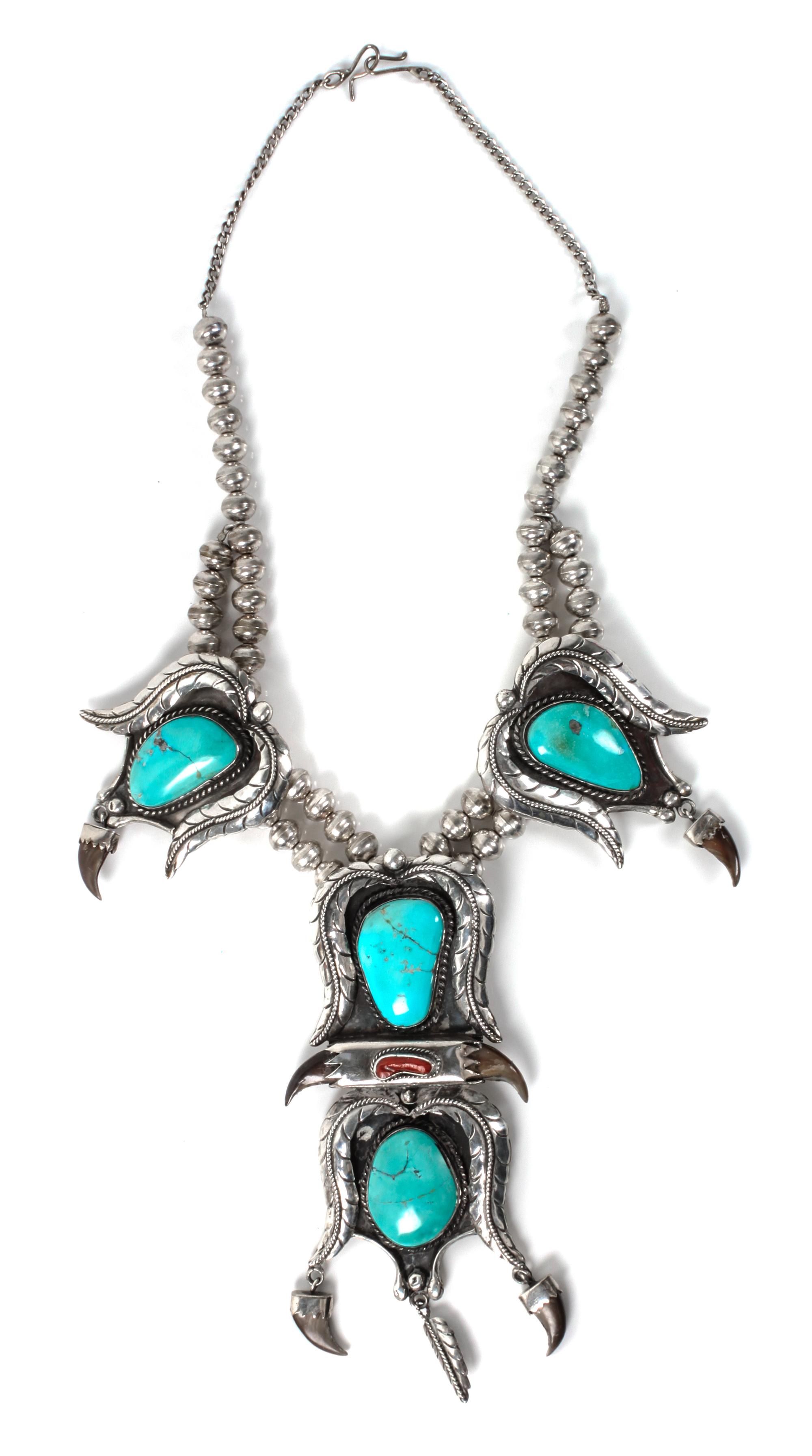 A Large Silver, Turquoise and Coral Pendant Necklace Length 20 inches; height of pendant 6 x width 2 3/4 inches.