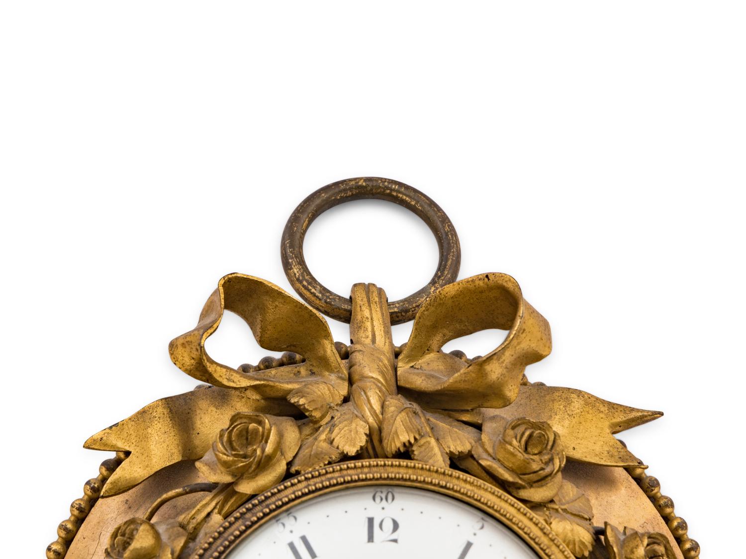 A Louis XVI Gilt Bronze Wall Clock