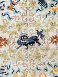 A Chinese Silk Rug with Lions