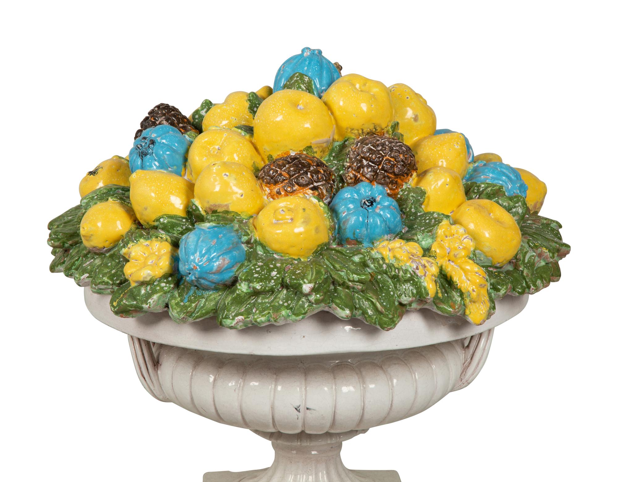A Large Italian Glazed Terra Cotta Model of a Fruit-Filled Urn with Snails and Frogs