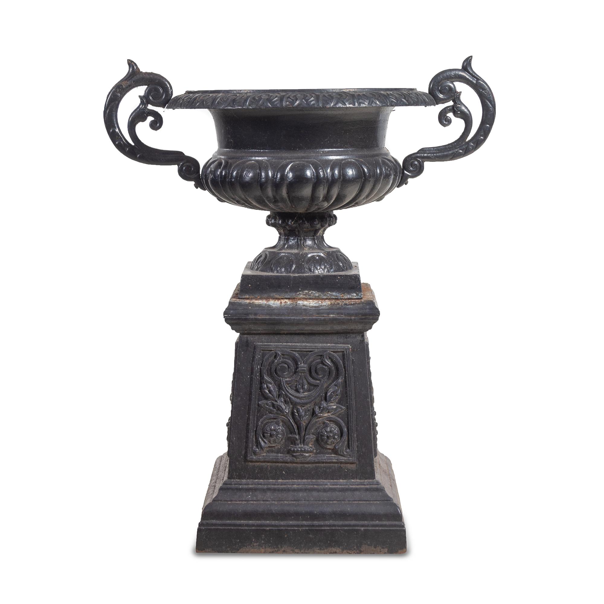 A Painted Cast Iron Garden Urn and Pedestal