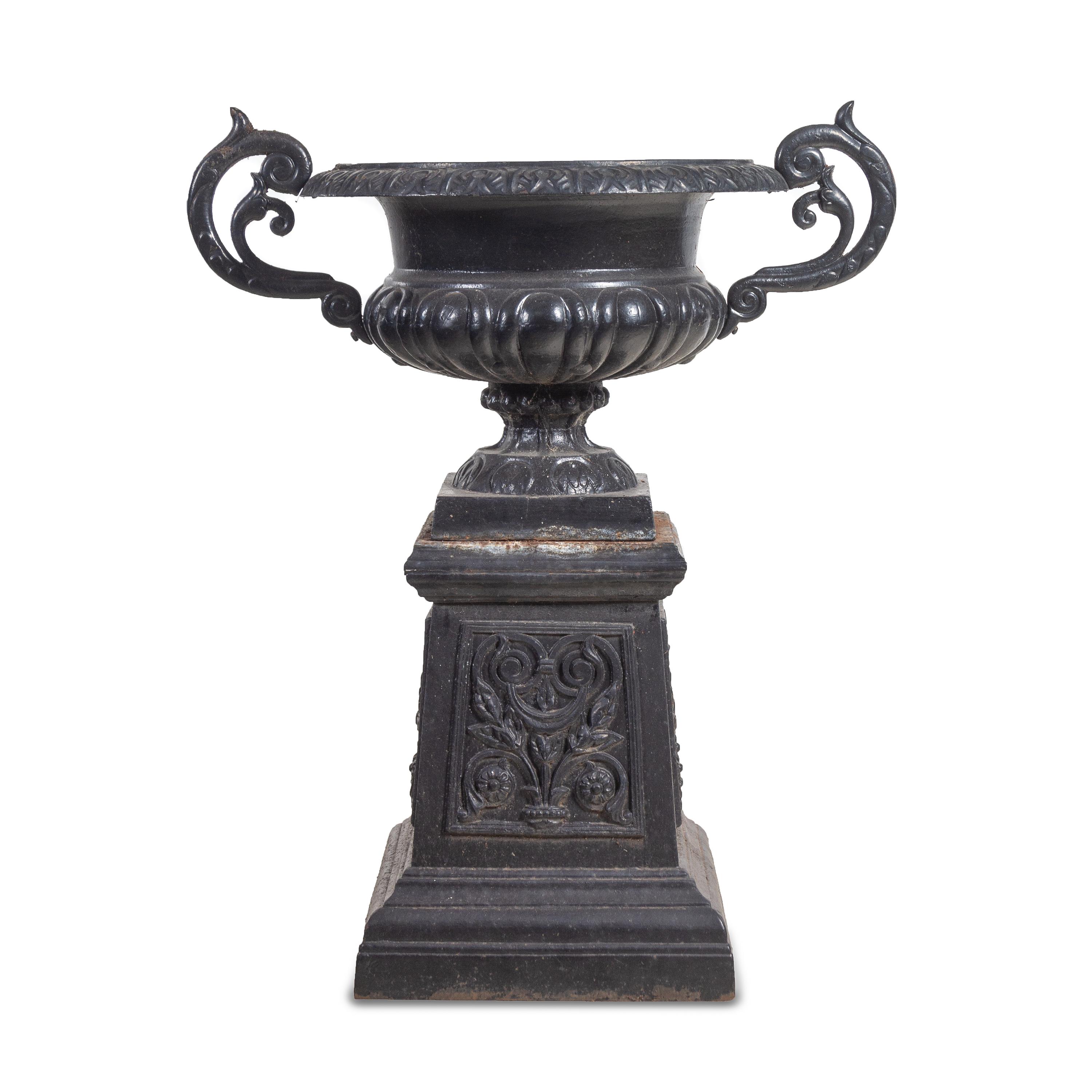 A Painted Cast Iron Garden Urn and Pedestal