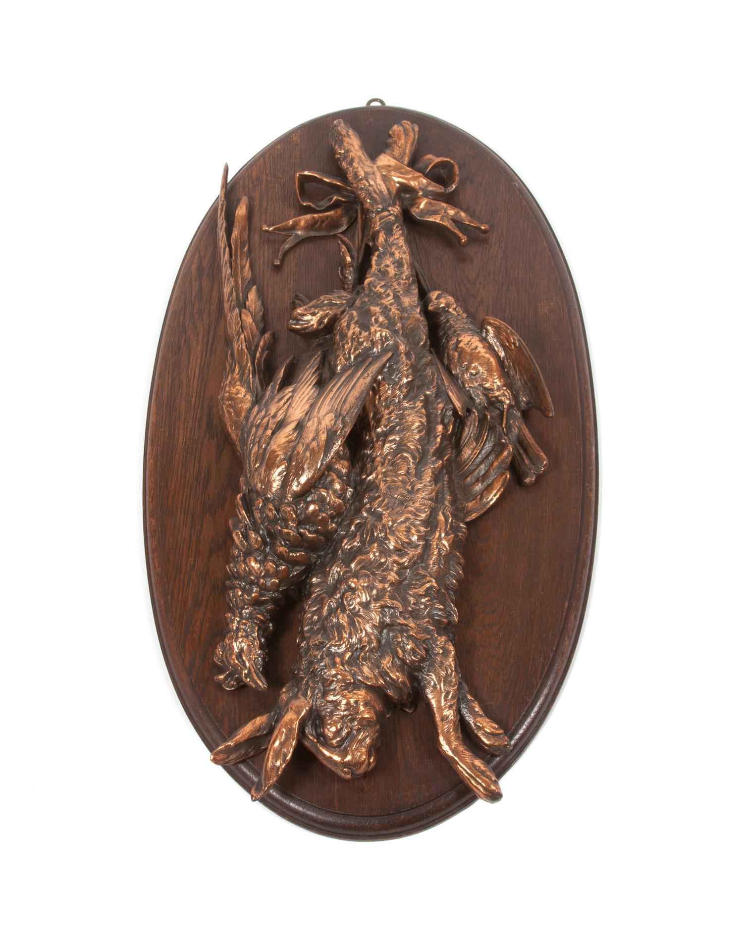 A Pair of Copper or Brass Game Mounts Height overall 31 x width 16 inches.