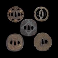Group of ten Japanese inlaid iron tsuba Edo period or earlier