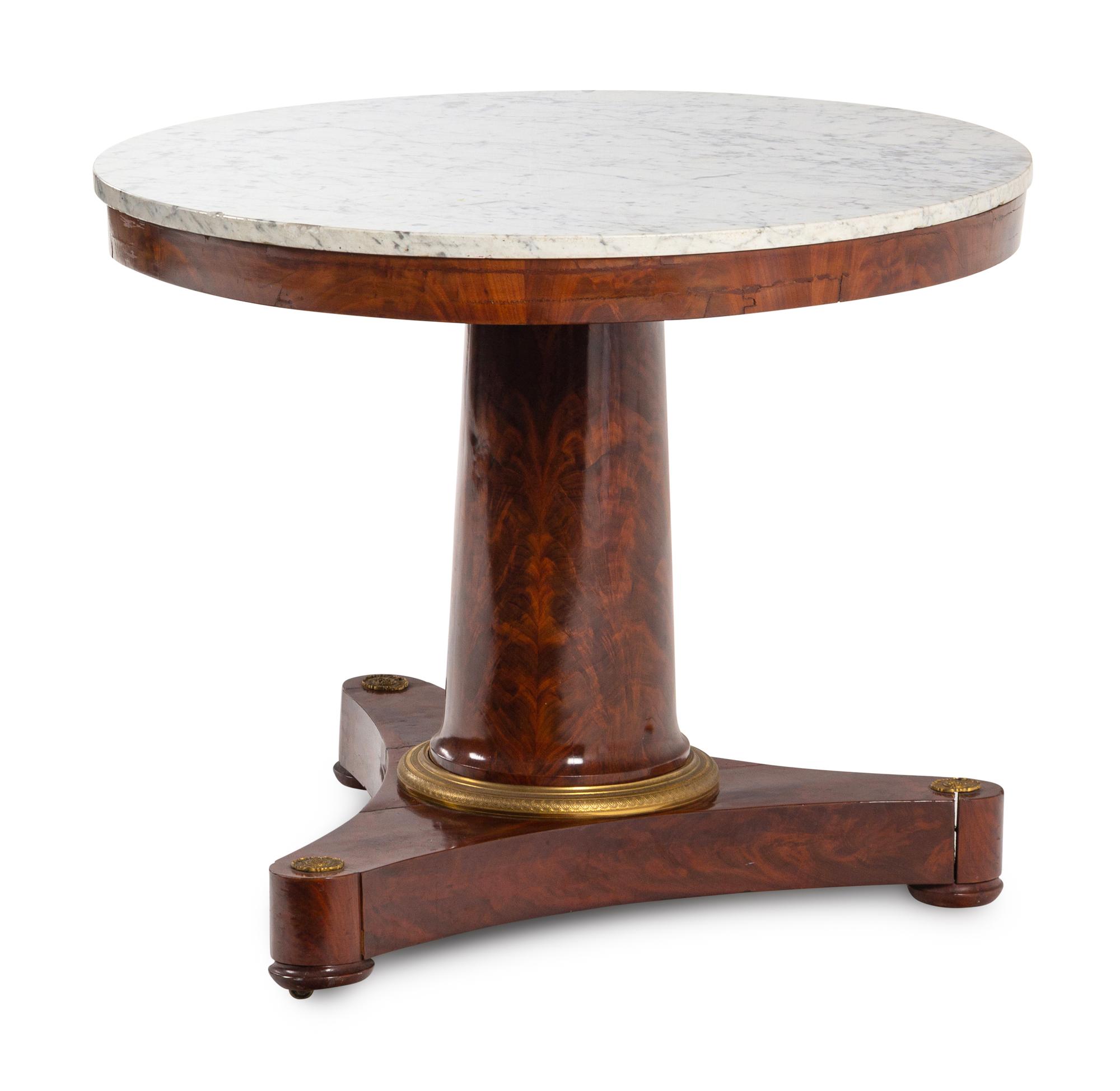 An Empire Gilt Bronze-Mounted Marble-Top Mahogany Center Table