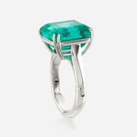 An emerald and platinum ring, Cartier