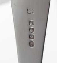 A George III Silver Fish Server, William Ely & William Fearn, London, 1807, the handle with an engraved crest of an arm embowed clutchi