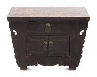 A Chinese Carved and Black Painted Wood Diminutive Chest