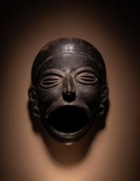 An Olmec Blackware Effigy Vessel in the Form of a Human Face