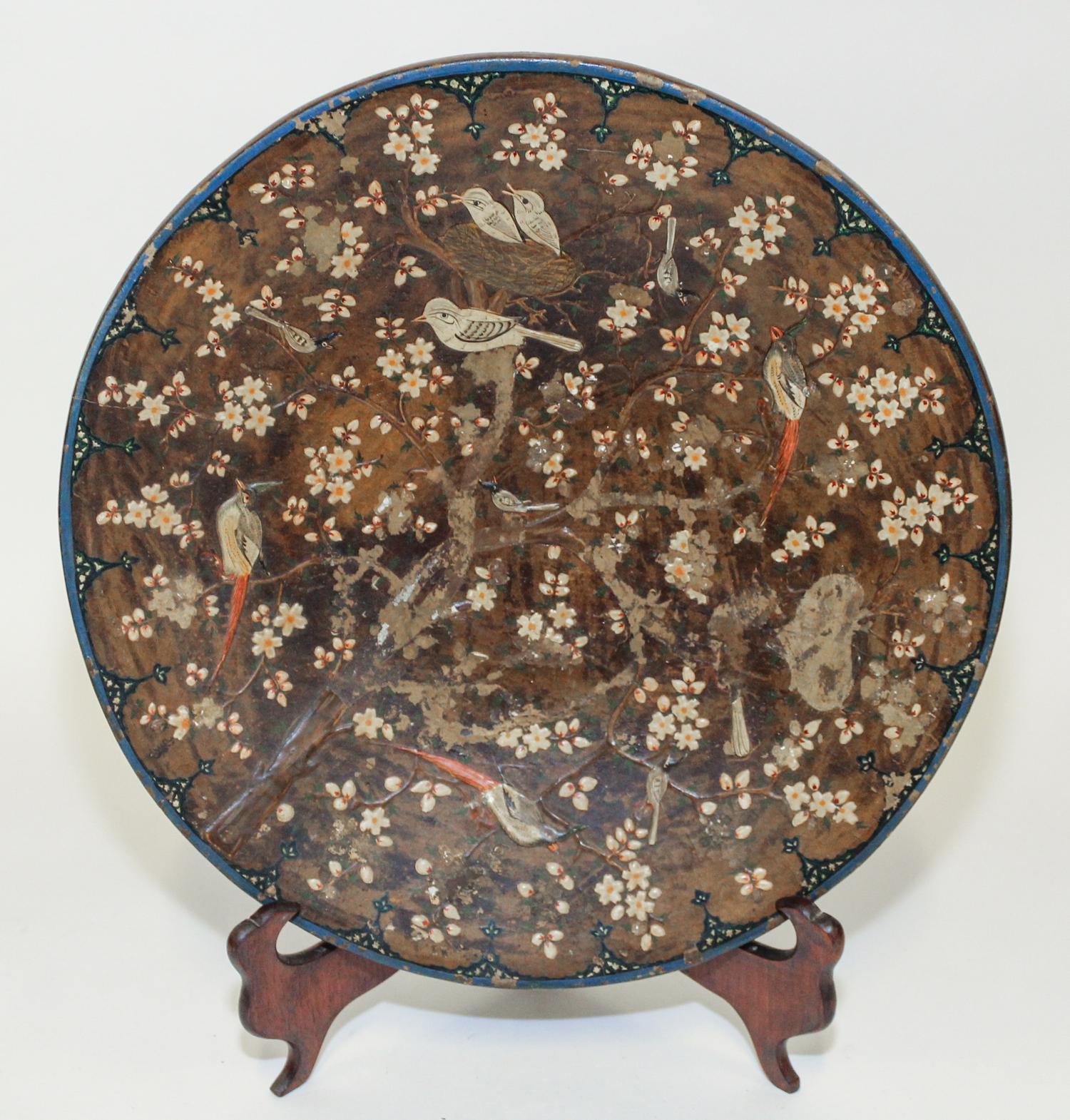 An Indian Papier Mache Charger Diameter 15 1/2 inches. — EARLY 20TH CENTURY